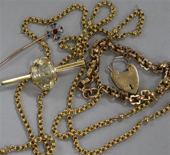 Two yellow metal brooches, a bracelet, a pin and a chain.